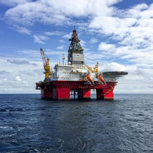Majestic offshore oil platform under a bright sky in the North Sea, showcasing Norway's energy infrastructure.